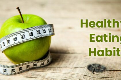 Zdrowy posiłek na drewnianym stole – kolorowy owoc, pełnoziarniste produkty i zdrowe źródła białka, symbolizujące dobre nawyki żywieniowe.