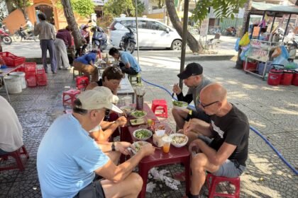 conversation over a shared meal at a street food table
